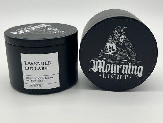 Black candle jar with 'Lavender Lullaby' label and 'Mourning Light' branding on a white background