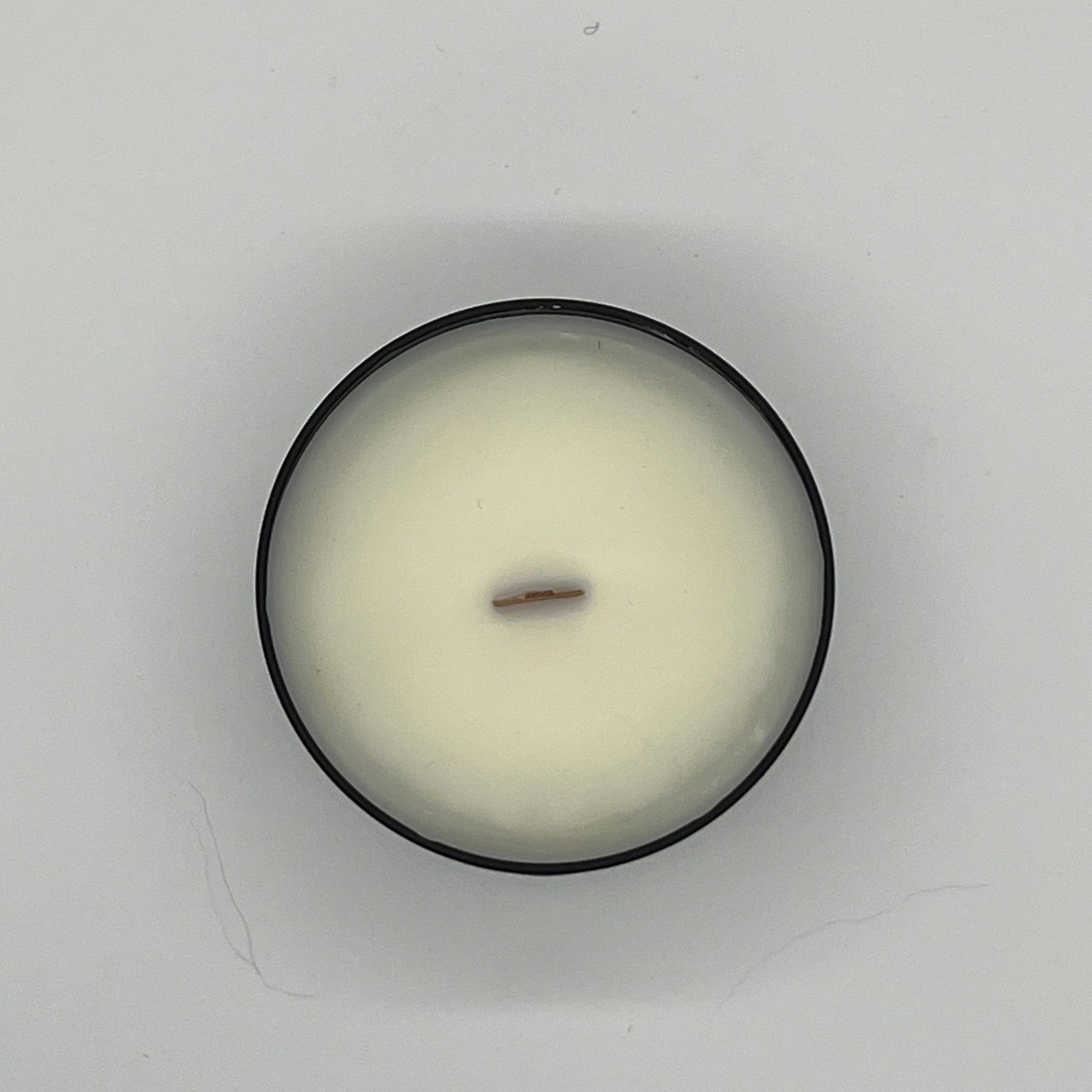 Aerial view of Mourning Light Soy Wax Candle with Lid off.